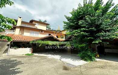 Imagem: A casa possui 5 Dormitórios, 5 Banheiros, 5 Vagas na garagem