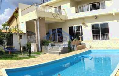 Imagem: A casa possui 5 Dormitórios, 4 Banheiros, 5 Vagas na garagem