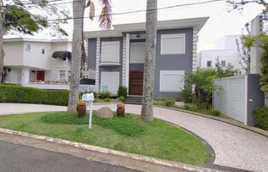 Imagem: A casa possui 5 Dormitórios, 5 Banheiros, 5 Vagas na garagem