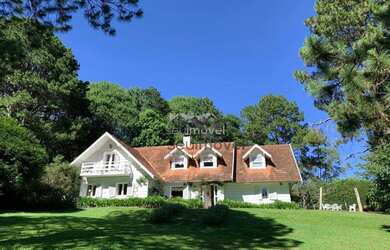 Imagem: A casa possui 5 Dormitórios, 5 Banheiros, 4 Vagas na garagem