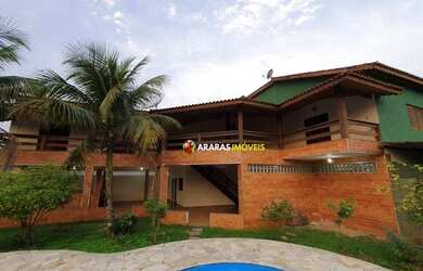 Imagem: A casa possui 5 Dormitórios, 5 Banheiros, 4 Vagas na garagem