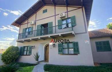 Imagem: A casa possui 3 Dormitórios, 2 Banheiros, 5 Vagas na garagem