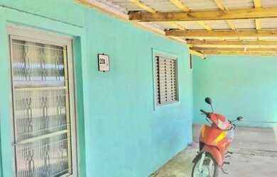 Imagem: A casa possui 3 Dormitórios, 2 Banheiros, 1 Vaga na garagem