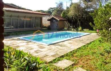 Imagem: A casa possui 3 Dormitórios, 5 Banheiros, 5 Vagas na garagem