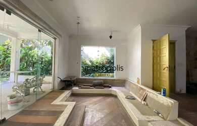 Imagem: A casa possui 3 Dormitórios, 4 Banheiros, 4 Vagas na garagem