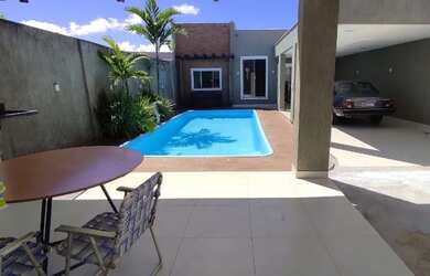 Imagem: A casa possui 3 Dormitórios, 3 Banheiros, 5 Vagas na garagem