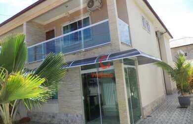 Imagem: A casa possui 3 Dormitórios, 4 Banheiros, 3 Vagas na garagem