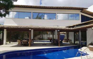 Imagem: A casa possui 4 Dormitórios, 5 Banheiros, 5 Vagas na garagem