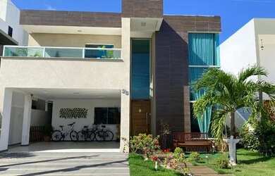 Imagem: A casa possui 4 Dormitórios, 5 Banheiros, 4 Vagas na garagem