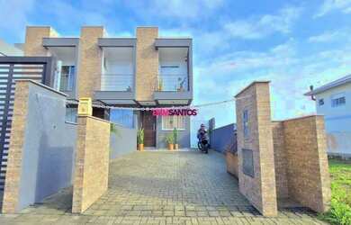 Imagem: A casa possui 3 Dormitórios, 1 Banheiro, 2 Vagas na garagem