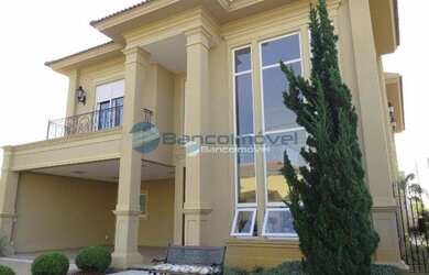 Imagem: A casa em condomínio possui 4 Dormitórios, 5 Banheiros, 4