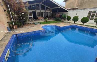 Imagem: A casa possui 5 Dormitórios, 4 Banheiros, 4 Vagas na garagem