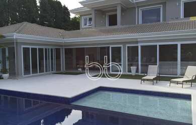 Imagem: A casa em condomínio possui 5 Dormitórios, 5 Banheiros, 5