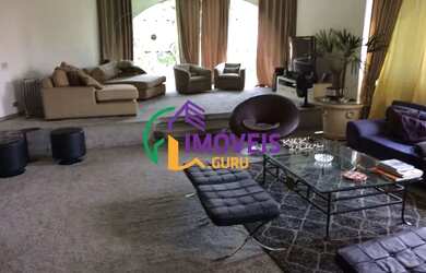 Imagem: A casa possui 4 Dormitórios, 5 Banheiros, 5 Vagas na garagem