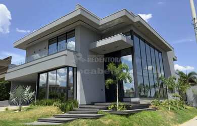 Imagem: A casa em condomínio possui 4 Dormitórios, 5 Banheiros, 2