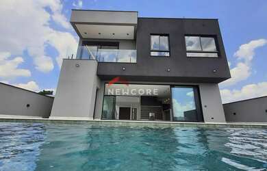 Imagem: A casa em condomínio possui 4 Dormitórios, 5 Banheiros, 5