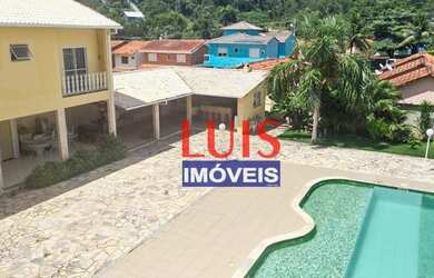 Imagem: A casa possui 5 Dormitórios, 5 Banheiros, 4 Vagas na garagem