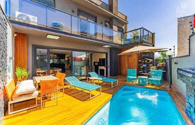 Imagem: A casa em condomínio possui 4 Dormitórios, 5 Banheiros, 5