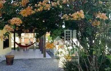 Imagem: A casa possui 4 Dormitórios, 2 Banheiros, 4 Vagas na garagem