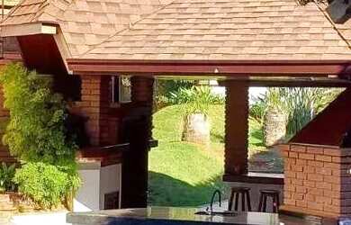 Imagem: A casa em condomínio possui 4 Dormitórios, 5 Banheiros, 5