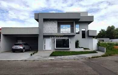 Imagem: A casa possui 3 Dormitórios, 5 Banheiros, 4 Vagas na garagem