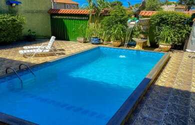 Imagem: A casa possui 5 Dormitórios, 5 Vagas na garagem e está localizado