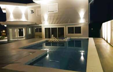 Imagem: A casa em condomínio possui 4 Dormitórios, 5 Banheiros, 5