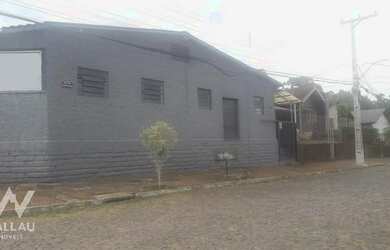 Imagem: A casa e possui 2 Dormitórios, Suítes, 2 Banheiros, 2 Vagas