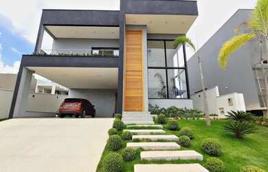 Imagem: A casa possui 5 Dormitórios, 4 Banheiros, 4 Vagas na garagem