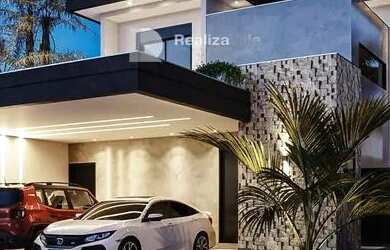 Imagem: A casa possui 4 Dormitórios, 5 Banheiros, 2 Vagas na garagem