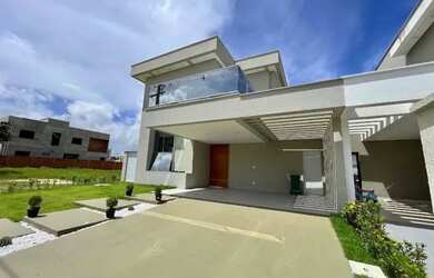 Imagem: A casa possui 4 Dormitórios, 4 Banheiros, 4 Vagas na garagem