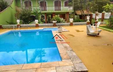 Imagem: A casa possui 5 Dormitórios, 4 Banheiros, 5 Vagas na garagem