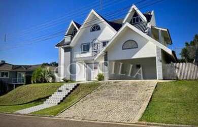 Imagem: A casa em condomínio possui 4 Dormitórios, 5 Banheiros, 4