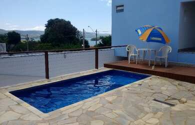 Imagem: A casa possui 3 Dormitórios, 4 Vagas na garagem e está localizado