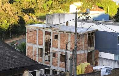 Imagem: A casa possui 4 Dormitórios, 4 Banheiros, 2 Vagas na garagem