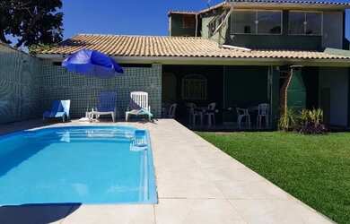 Imagem: A casa possui 3 Dormitórios, 5 Vagas na garagem e está localizado