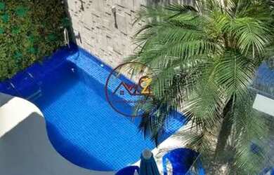 Imagem: A casa possui 5 Dormitórios, 5 Banheiros, 2 Vagas na garagem