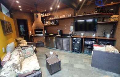 Imagem: A casa possui 3 Dormitórios, 5 Banheiros, 4 Vagas na garagem