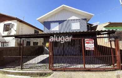 Imagem: A casa possui 4 Dormitórios, 2 Banheiros, 2 Vagas na garagem