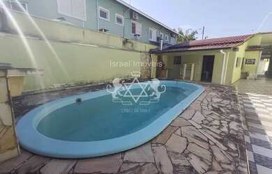 Imagem: A casa possui 4 Dormitórios, 4 Banheiros, 5 Vagas na garagem