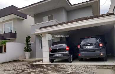 Imagem: A casa possui 4 Dormitórios, 4 Banheiros, 2 Vagas na garagem