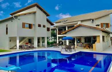 Imagem: A casa possui 5 Dormitórios, 5 Banheiros, 5 Vagas na garagem