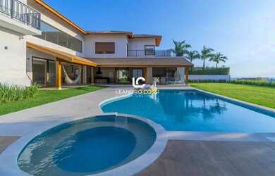 Imagem: A casa em condomínio possui 5 Dormitórios, 5 Banheiros, 4