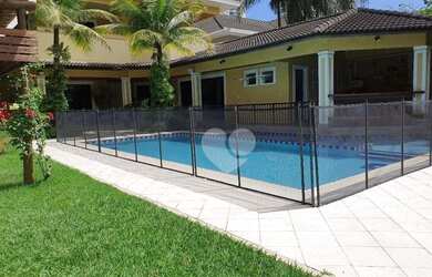 Imagem: A casa em condomínio possui 4 Dormitórios, 5 Banheiros, 5