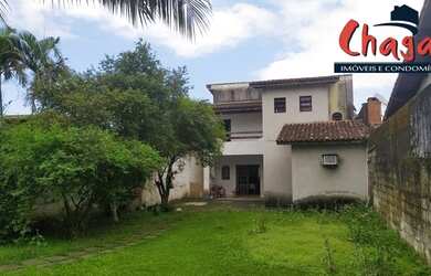 Imagem: A casa possui 5 Dormitórios, 1 Banheiro, 5 Vagas na garagem