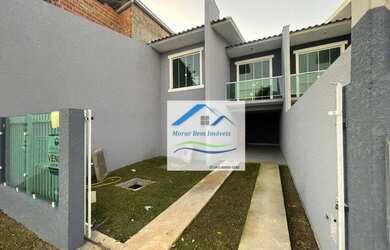 Imagem: A casa possui 3 Dormitórios, 2 Banheiros, 2 Vagas na garagem