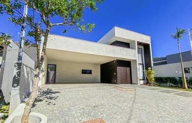 Imagem: A casa possui 3 Dormitórios, 5 Banheiros, 4 Vagas na garagem