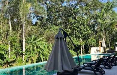 Imagem: A casa possui 4 Dormitórios, 5 Banheiros, 2 Vagas na garagem