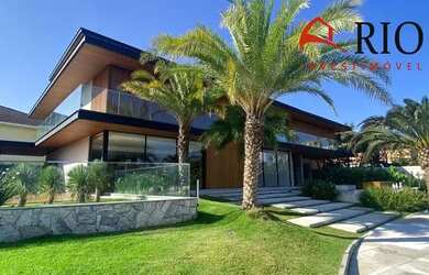 Imagem: A casa possui 5 Dormitórios, 5 Banheiros, 4 Vagas na garagem