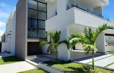 Imagem: A casa possui 4 Dormitórios, 5 Banheiros, 4 Vagas na garagem